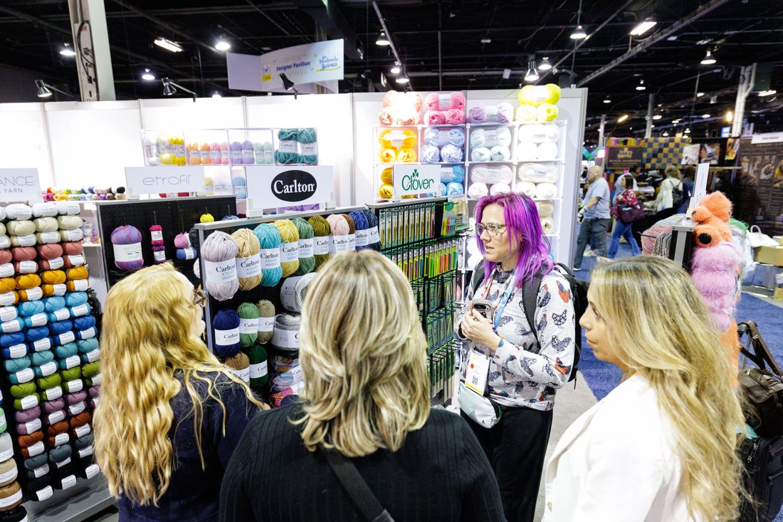 An exhibitor sharing a product catalog with a buyer