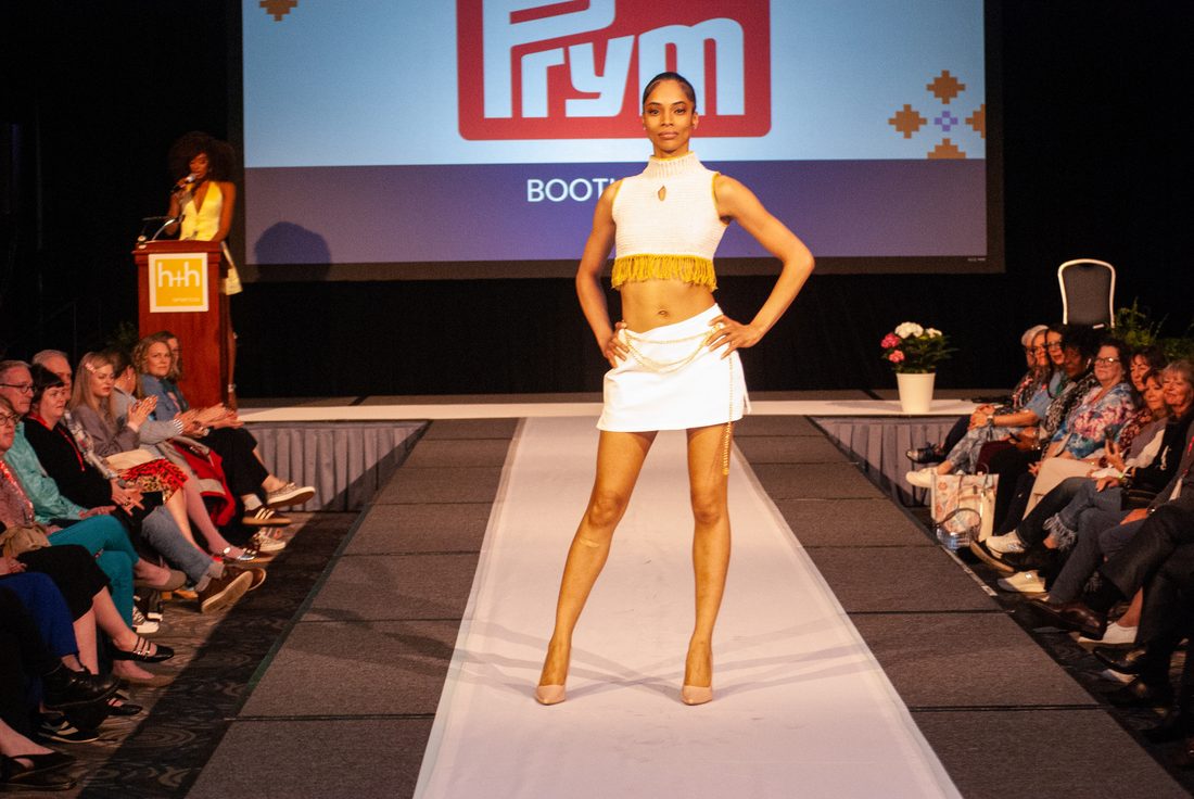 A patchwork ball gown on the fashion show runway